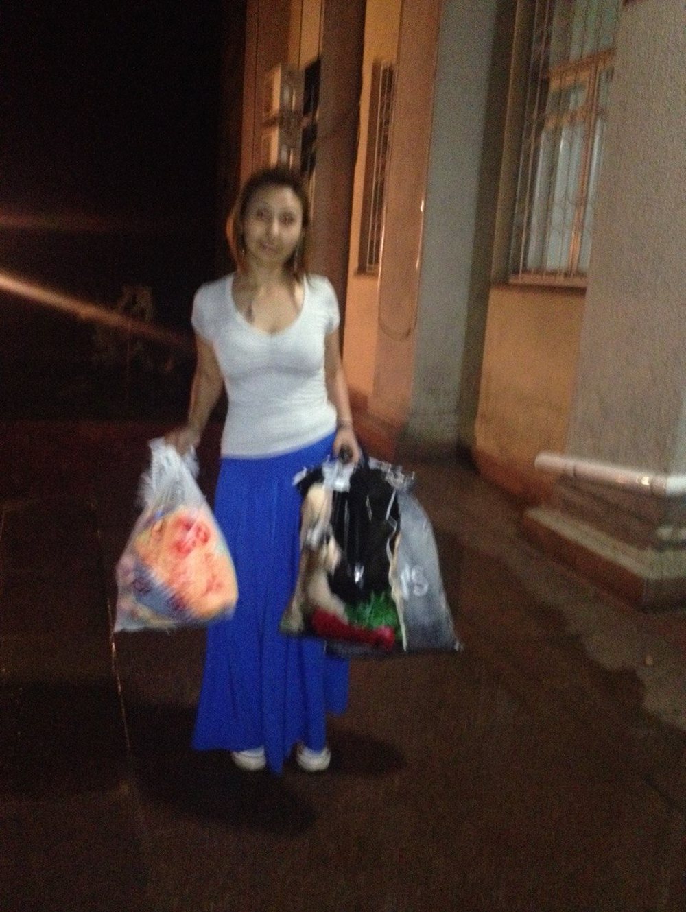 Delivering collected clothing at night in Bishkek